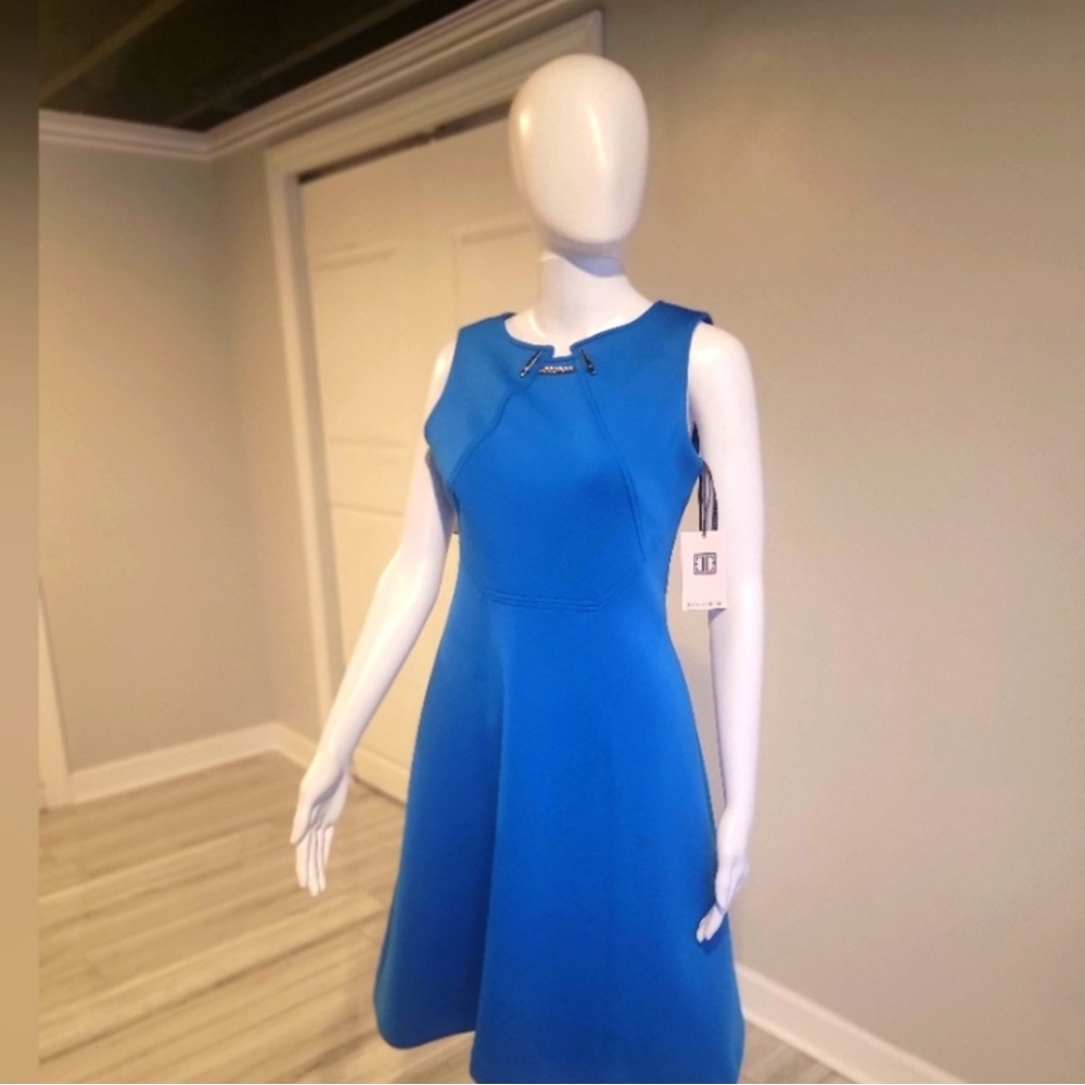Women’s size 2 dress by Ivanka Trump. Blue with gold accents
